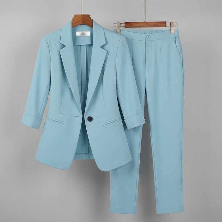 Kvinnors formella kostymset med blazer och byxor