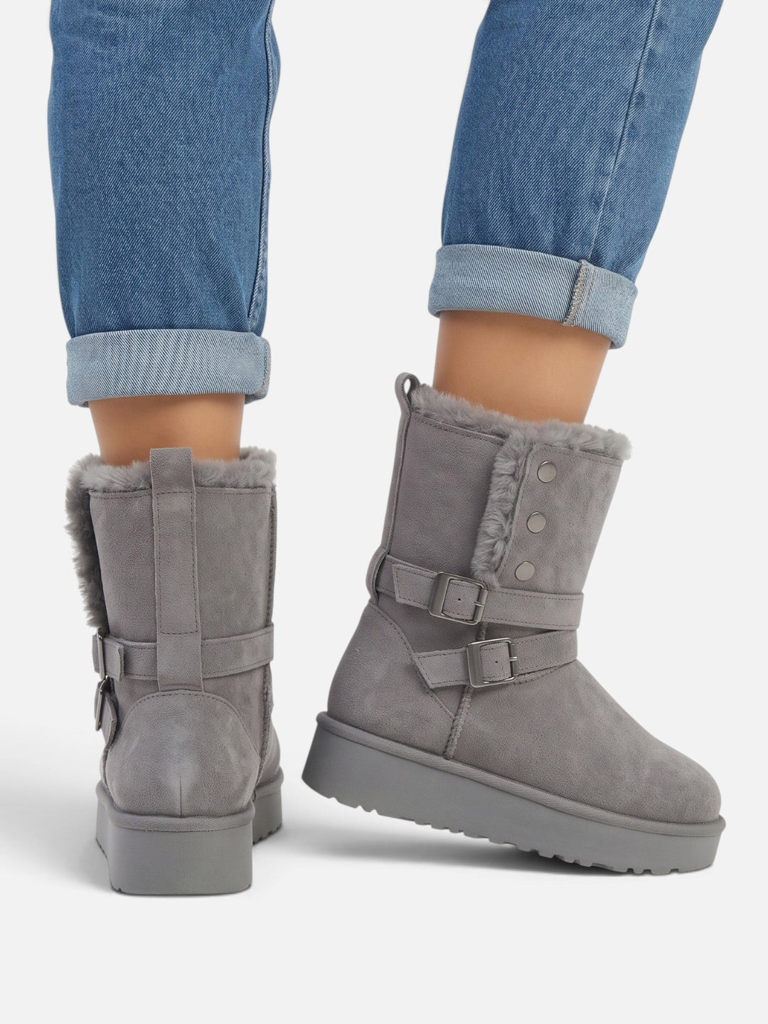 Boots i mockaimitation med fuskpäls och spännen för dam