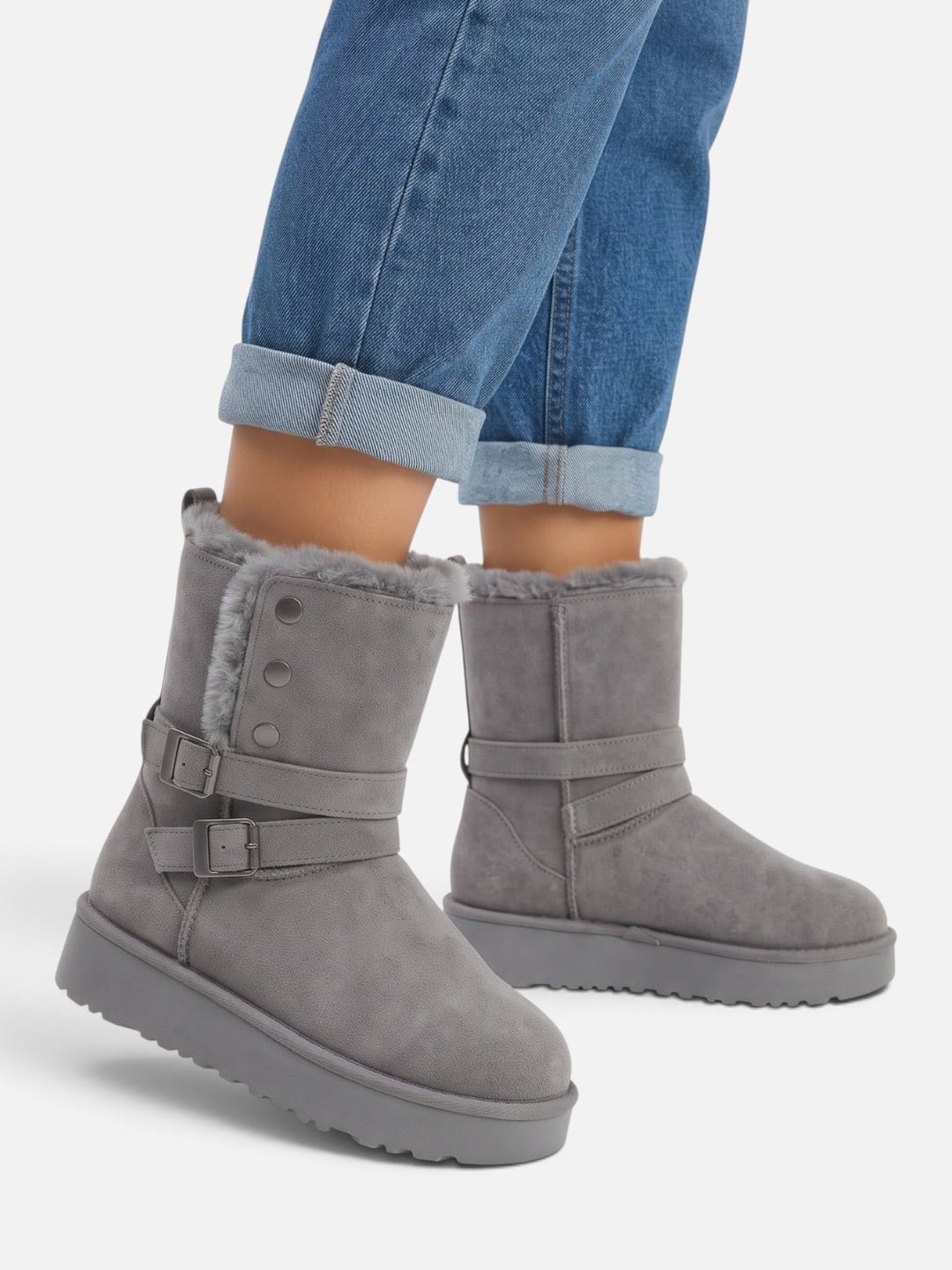 Boots i mockaimitation med fuskpäls och spännen för dam